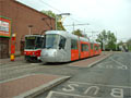 Tramvaje T6A5 č. 8713 a Škoda 14T č. 9111 v obratišti Smíchovské nádraží 29. 4. 2006