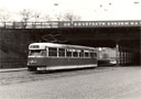 Vůz T2 č. 153 u nádraží s pěkným dobovým nápisem na mostě 4. 4. 1987, 
foto: Tomáš Palyza 